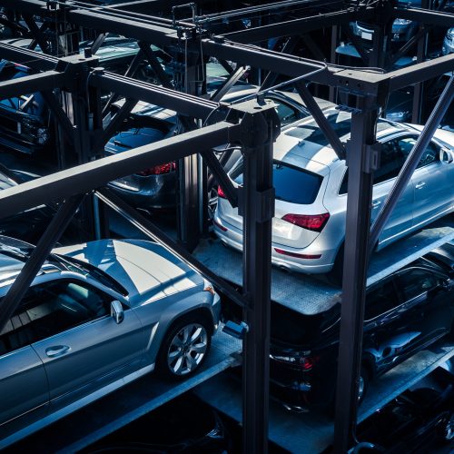 Car park, stacked parking garage in New York City. Color toned image, all signs carefully retouched.